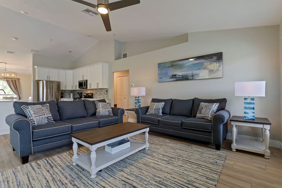 Living Room with 2 full size sofas and 65 inch smart tv