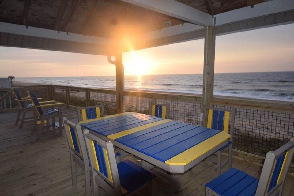 Enjoy a meal at the large table on the partially covered deck
