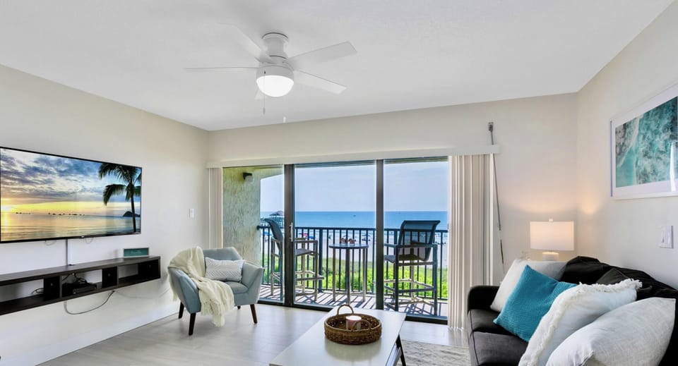 Perfect spot to unwind with ocean views and a 55” flatscreen TV for entertainment.