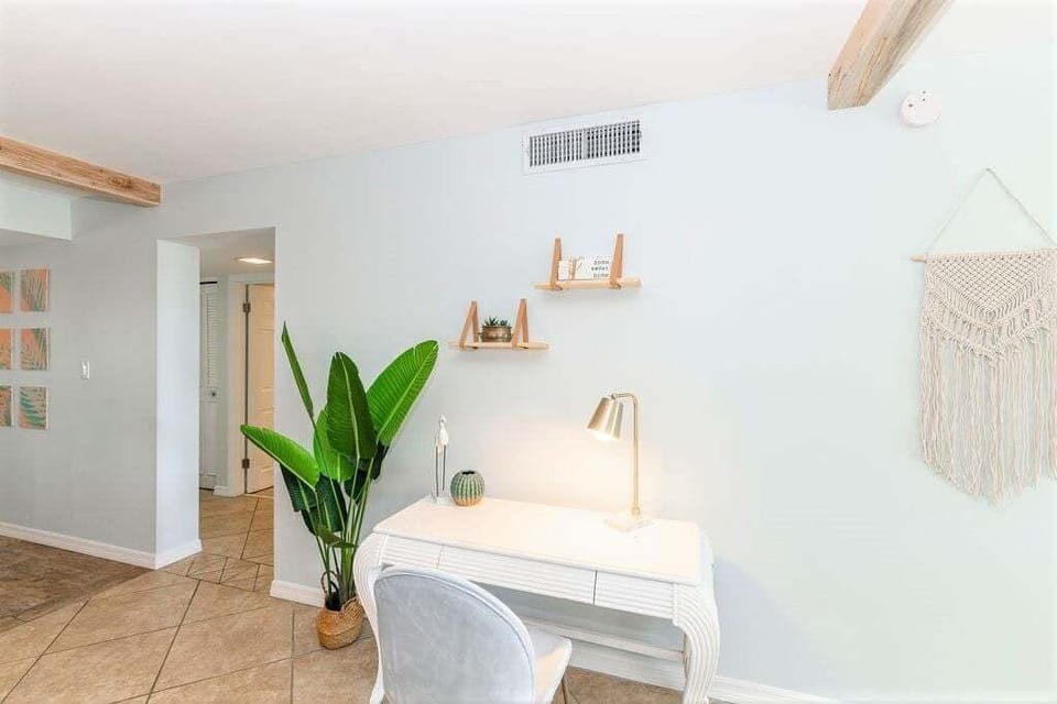 Stay productive in a cozy workspace with a sleek desk and natural light