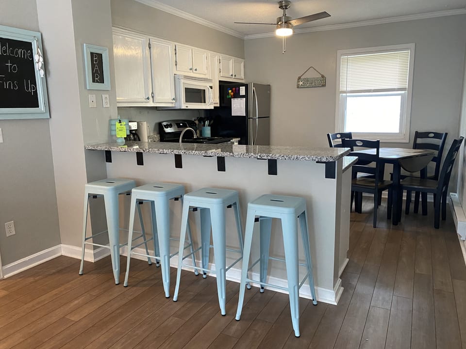 Open concept kitchen with granite bar