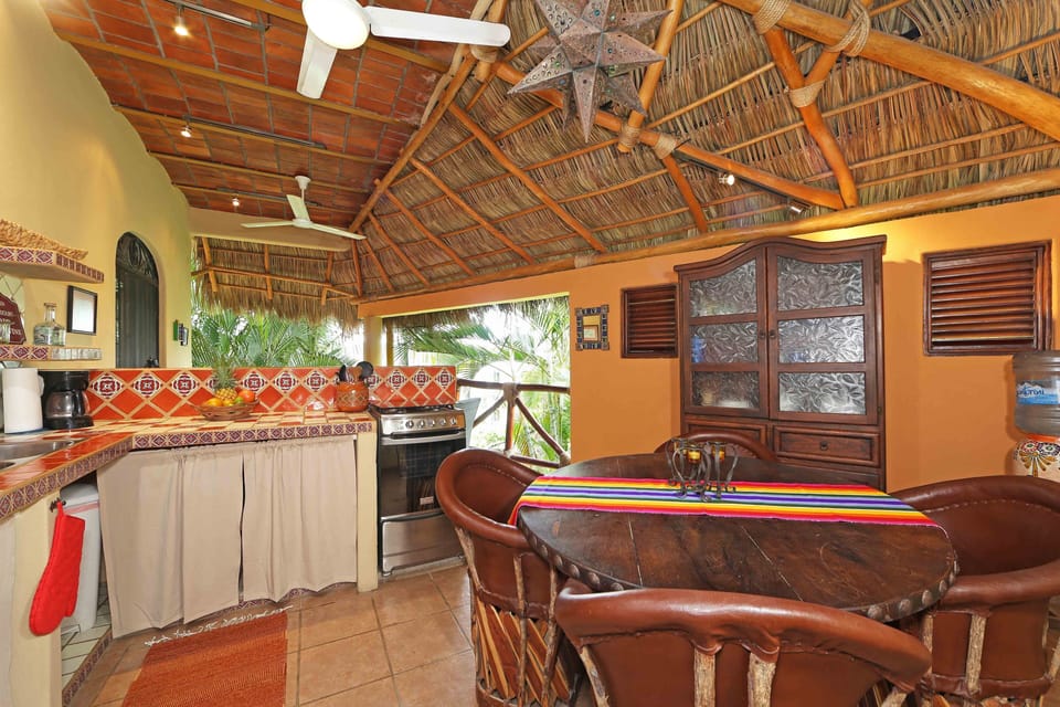 Open air kitchen and dining area.