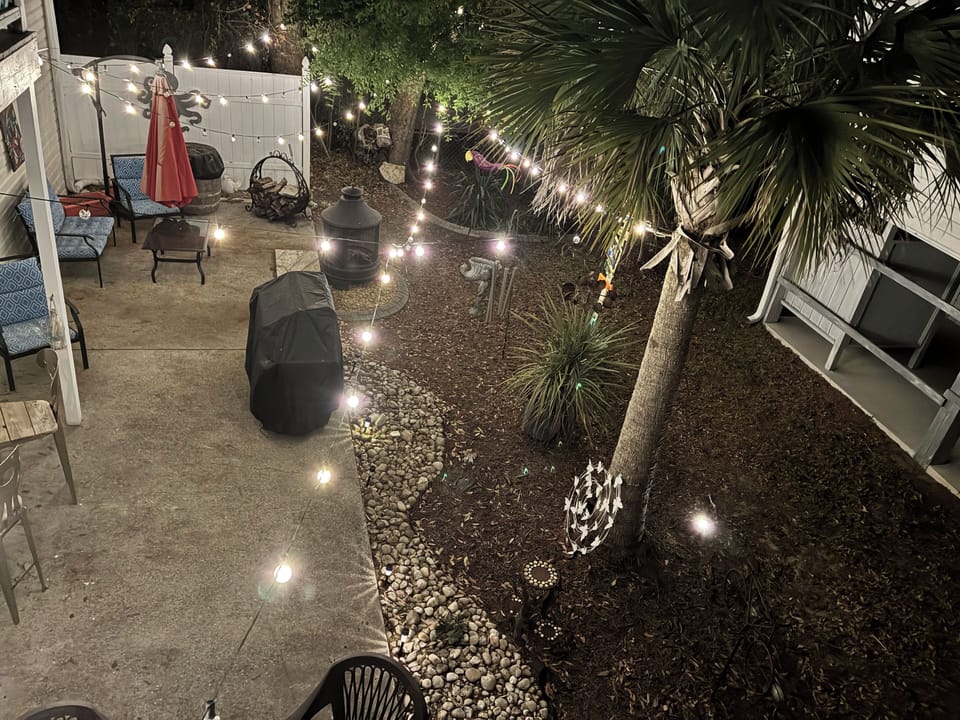 Great outdoor space includes fire pit plus outdoor bar and seating area