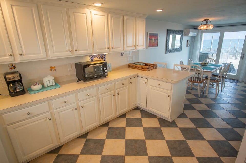 Spacious and fully stocked kitchen.