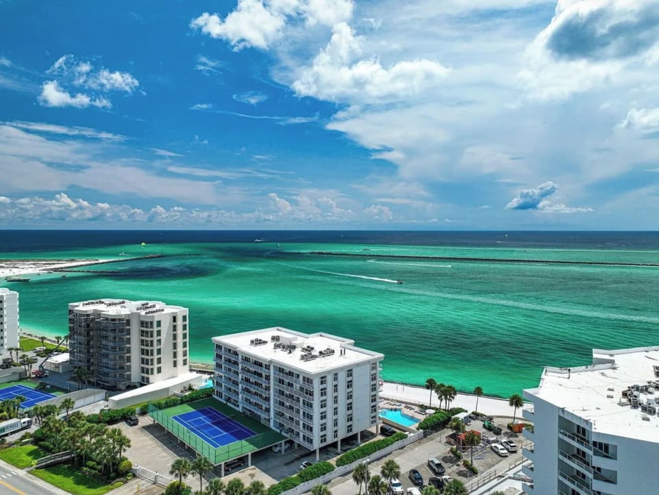 Our building overlooks the East Pass and Gulf of America beyond the Jetties.