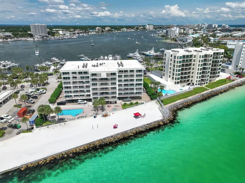 Building Complex showing private beach *surrounded by a rock sea wall