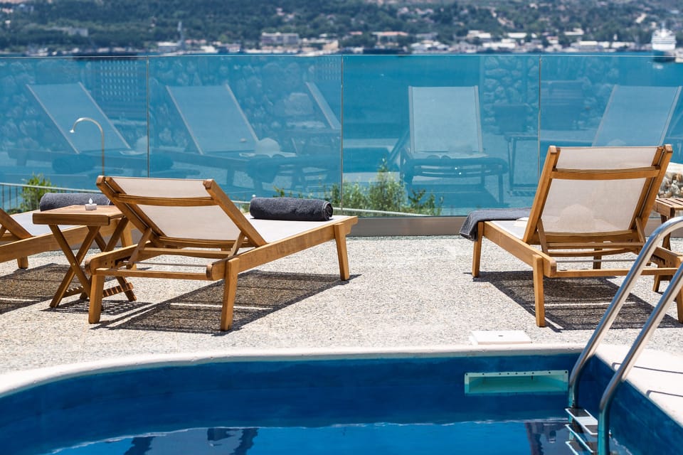 The pool terrace is equipped with sun beds.