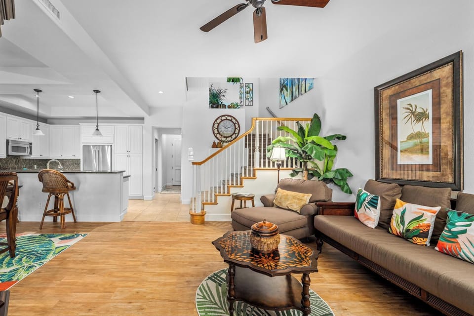 Open concept layout connects living room, dining, and kitchen