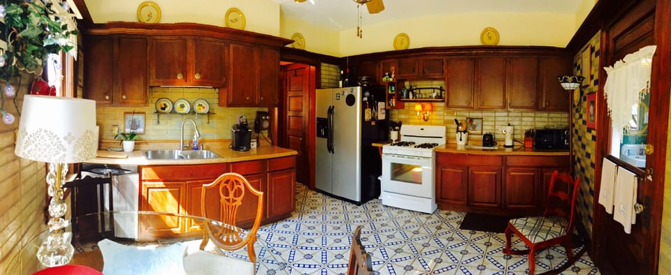 Sunny tiled kitchen/gas range
