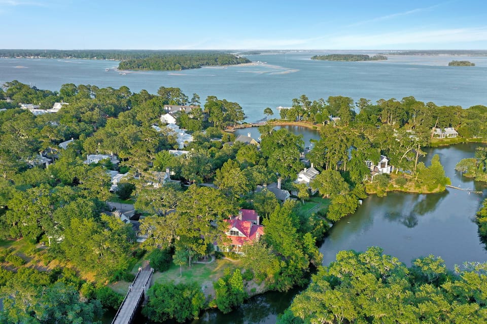 Aerial photo of the beautiful waters around the red-roofed home 14 Parkman
