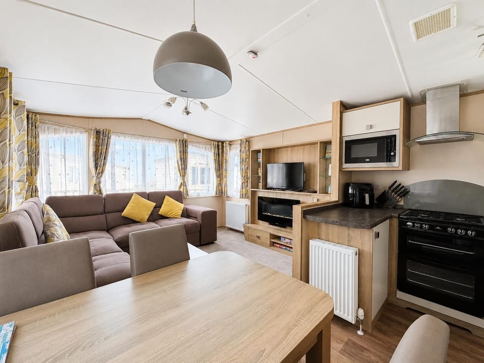 Make your UK holidays extra special by choosing a holiday home living room with a fireplace for chilly evenings.