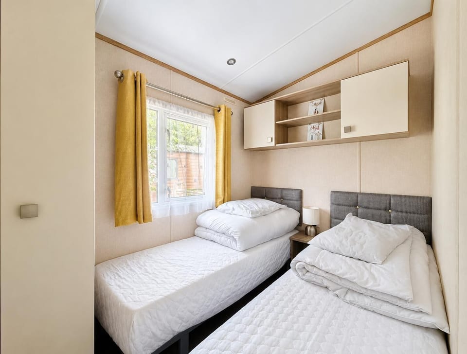 Enjoy a tranquil coastal getaway with a holiday bedroom designed for ultimate relaxation.