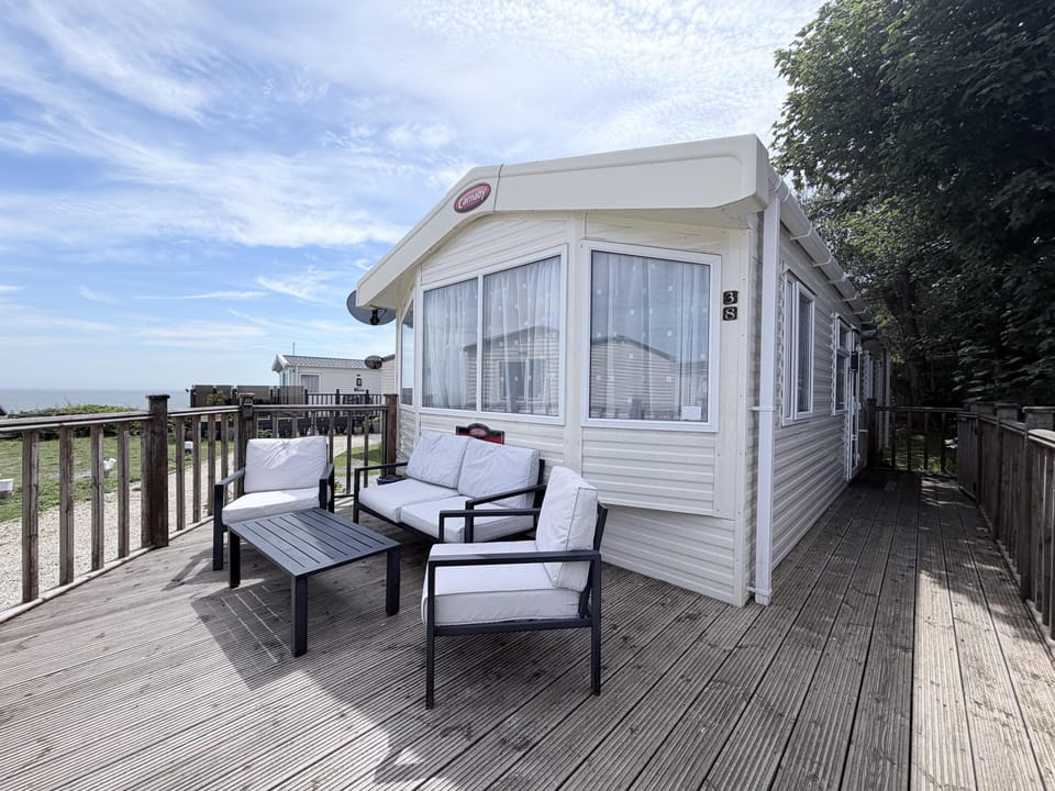 Relax on your caravan decking with a glass of wine, soaking in the beauty of the Suffolk Coast.