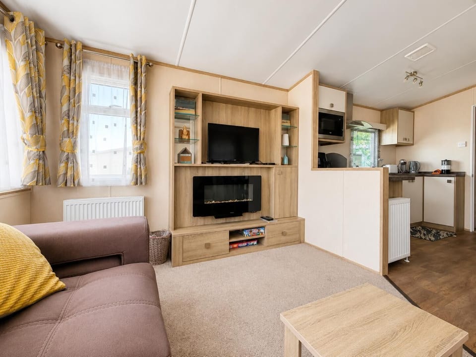 The static caravan dining area is both functional and inviting, making it a great spot for family dinners.
