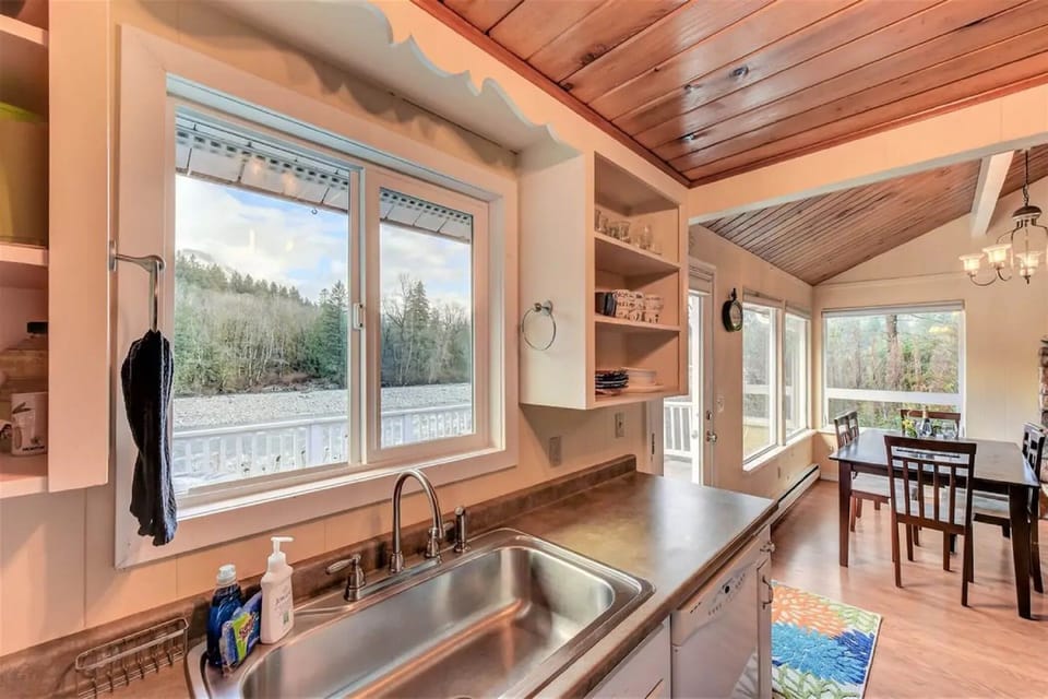 The kitchen provides plenty of counter space and river views beyond