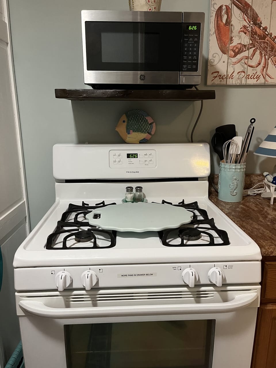 Gas stove with small microwave

