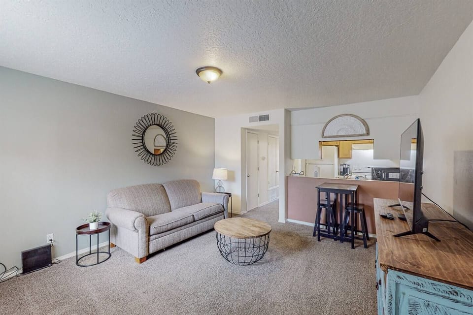 Living room area with small kitchen table nook