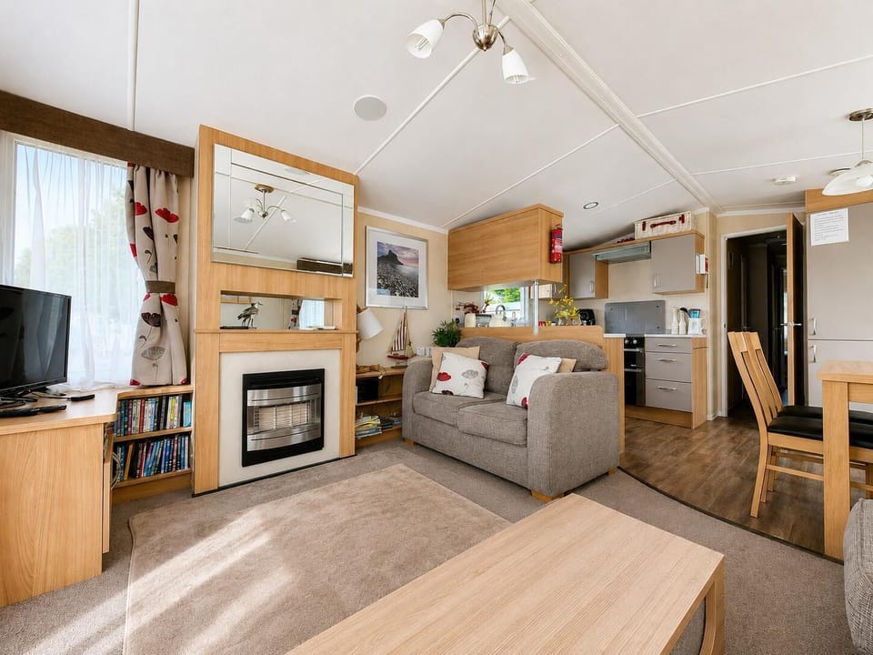 Practical caravan bedroom, designed to offer comfort and functionality for your UK travels!