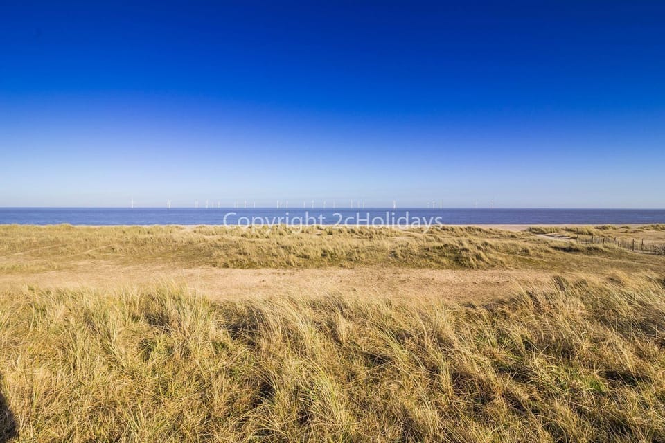 Enjoy the charming British seaside charm at Great Yarmouth beach, a vibrant destination that promises endless fun for your next family holiday.