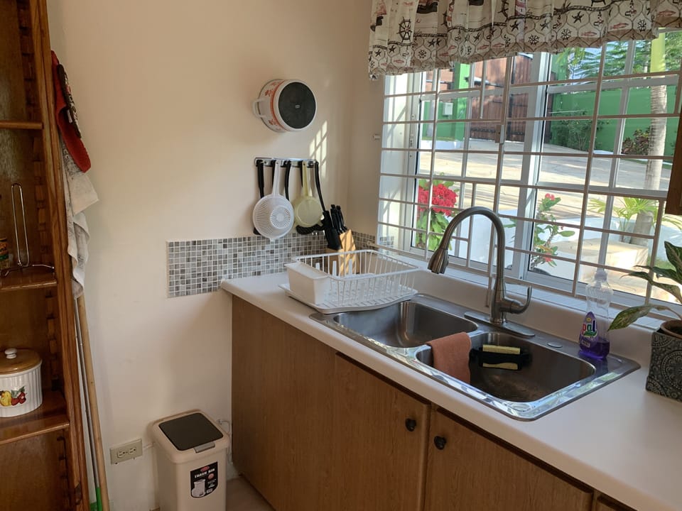 Enjoy the garden view across the beautifully designed pavement during meal prep
