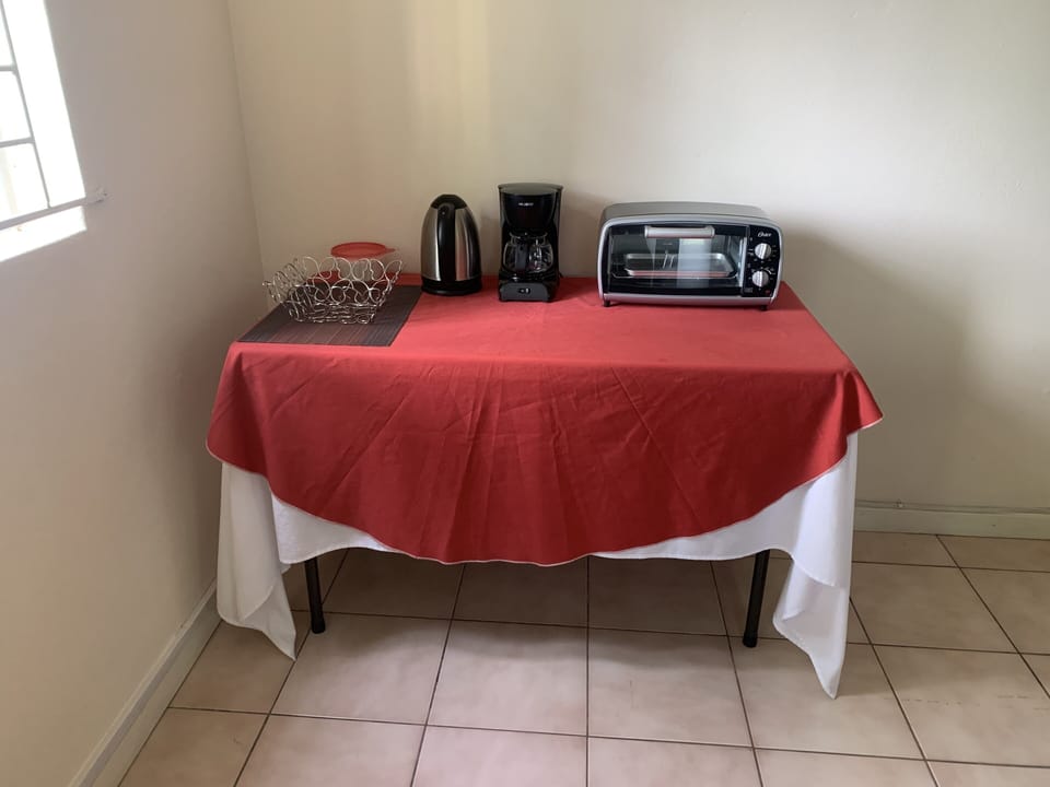 Coffee station includes kettle, coffee maker and filters, also a toaster/broiler