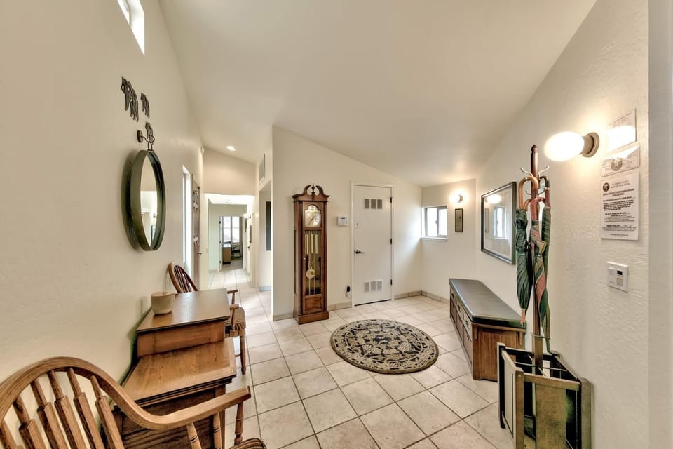 Step into your welcoming foyer where classic charm meets modern comfort, featuring elegant furnishings and thoughtful touches for your perfect mountain retreat.