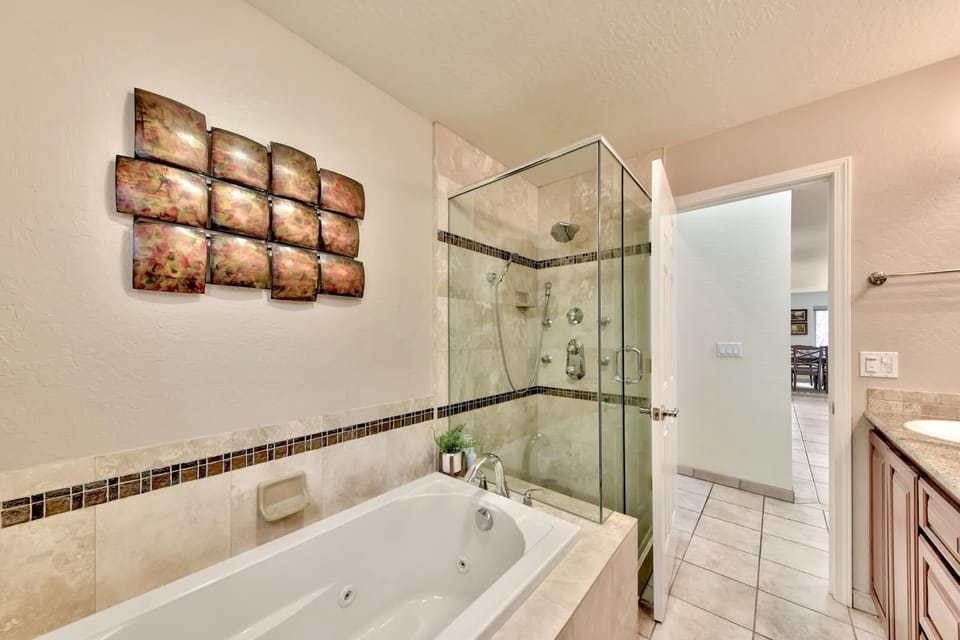 Unwind in your spa-like bathroom with a luxurious soaking tub and elegant glass-enclosed shower after your adventures.