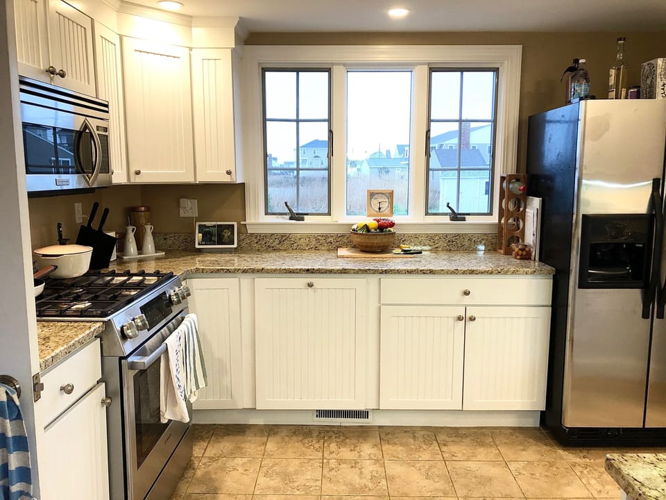 Kitchen overlooking backyard and deck.  New appliances in 2025.