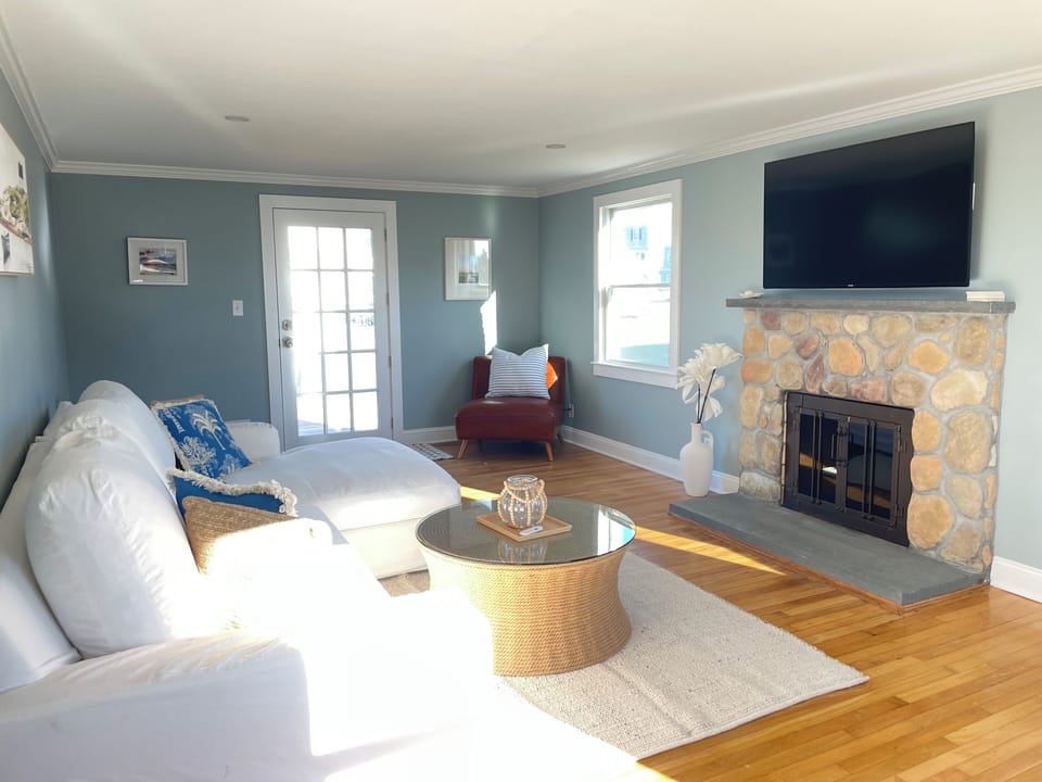 Living room with access to decks. 