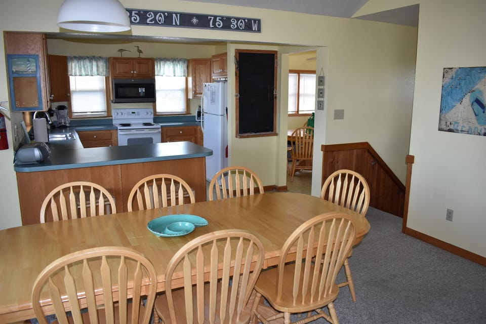 Kitchen and dining area, with view of game room/sun room.