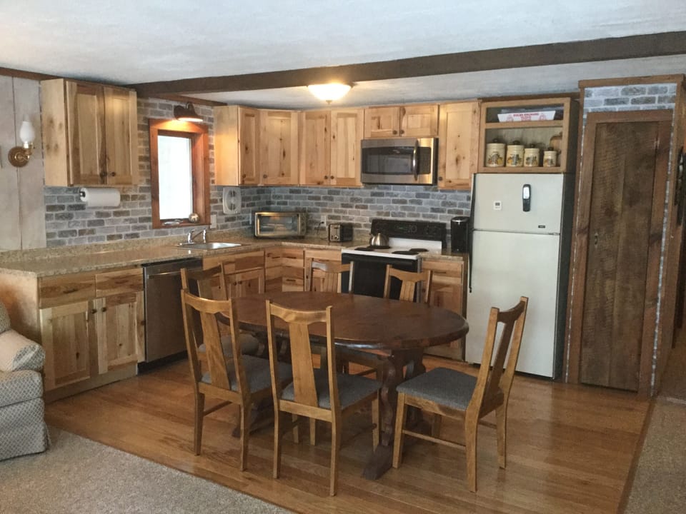Remodeled kitchen with new dishwasher and microwave.