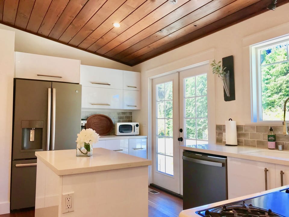 French doors in kitchen open onto patio 