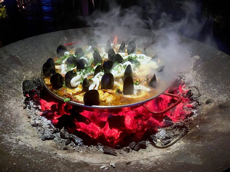 Cooking a Spanish paella on the firepit.