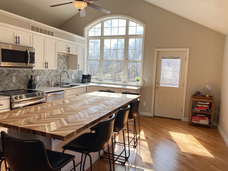 The beautifully crafted butcher block table doubles as extra counter space. 
