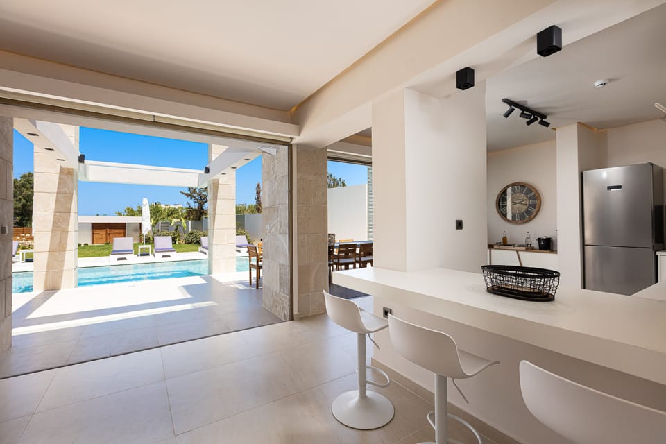 Lower floor kitchen with access to the pool terrace.