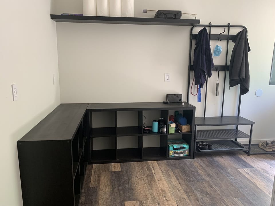 Mud Room with spots for helmets and gear right by rear door. 