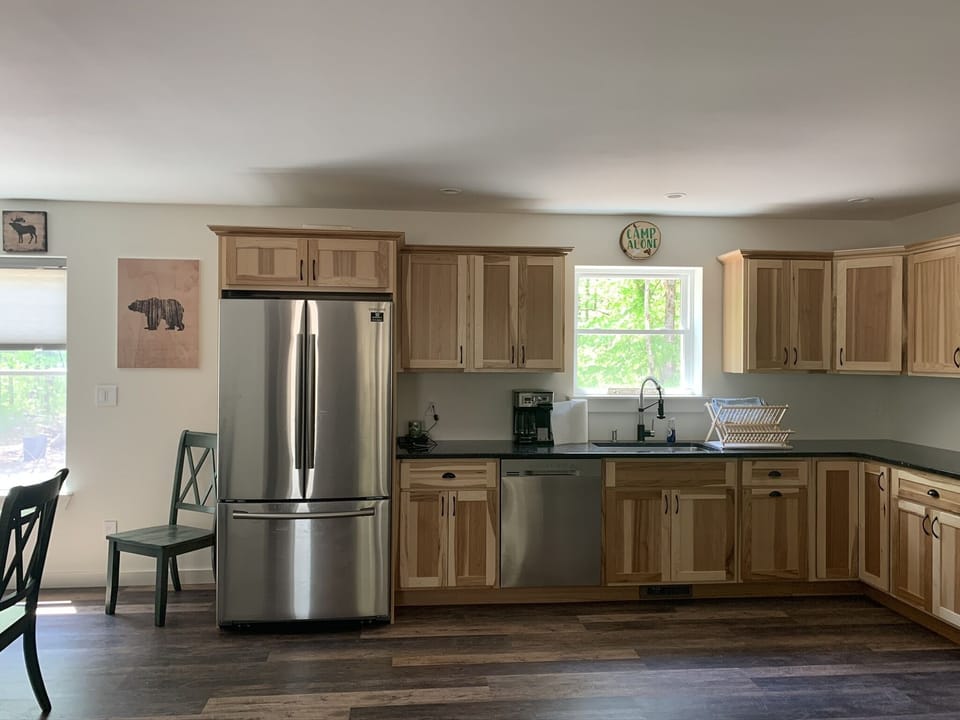 Stainless Steel Refrigerator, Dishwasher, microwave, and range 