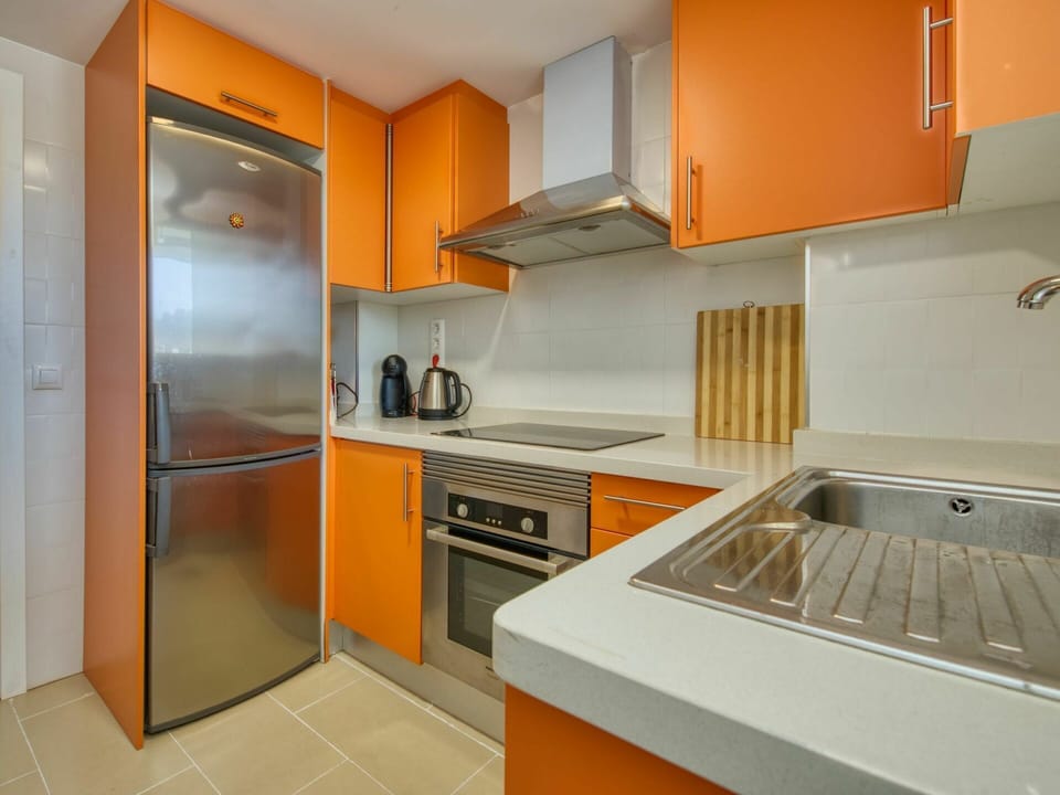 Room, Property, Countertop, Orange, Cabinetry, Kitchen, Furniture, Interior Design, Building, Yellow