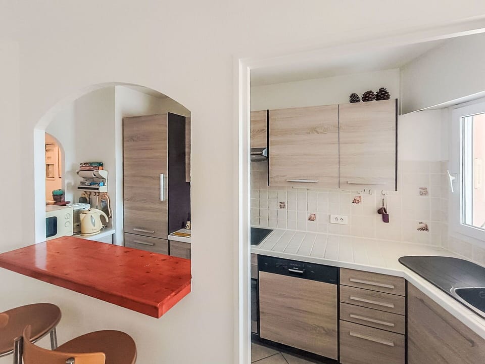 Furniture, Countertop, Flooring, Interior Design, Kitchen, Wood, Floor, Cabinetry, Kitchen Appliance, Major Appliance