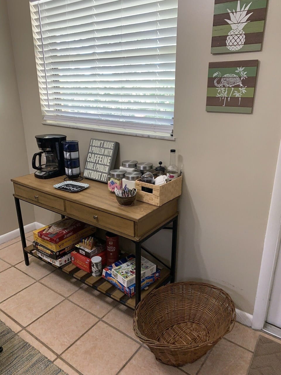 Fully stocked coffee bar w/ games stored under and in the drawers