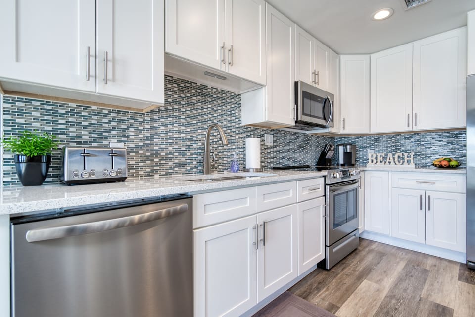 Spacious kitchen fully stocked.