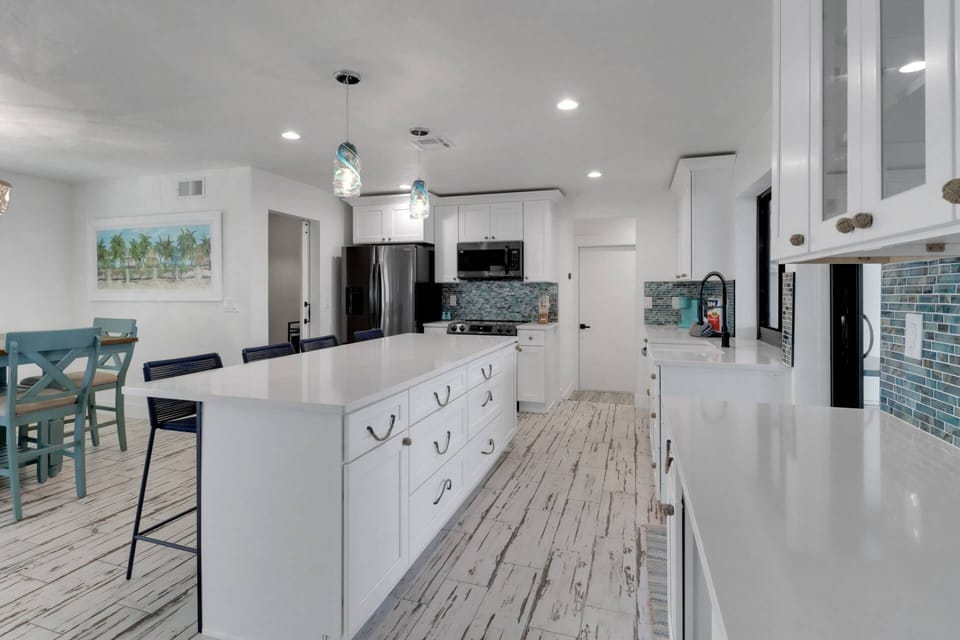 The kitchen enjoys upgraded appliances, granite counters, and is filled with the items needed to prepare meals for your group.