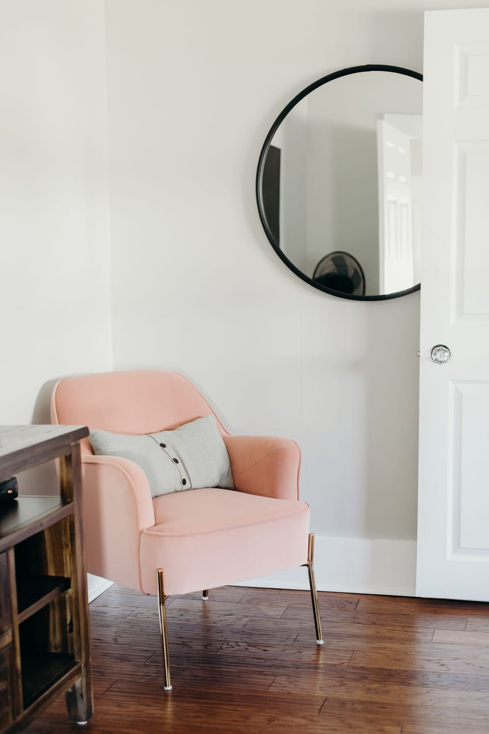Comfortable chair in queen bedroom . 