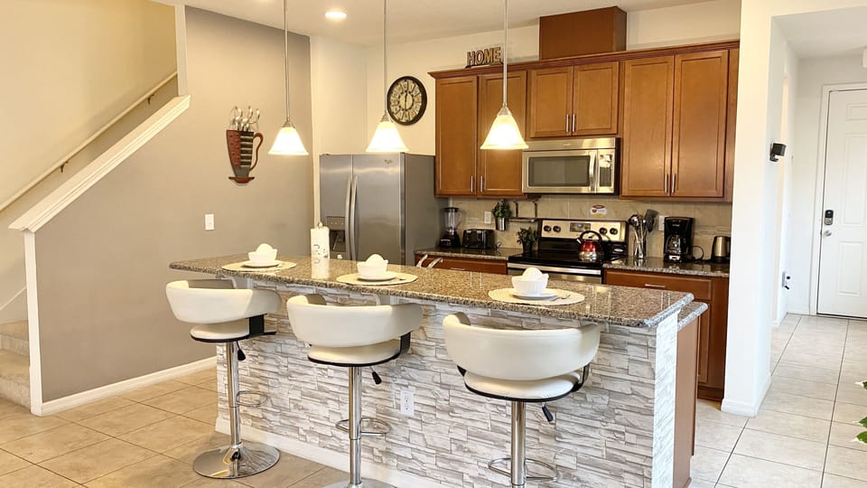 Enjoy culinary adventures in the fully-equipped kitchen with modern appliances.