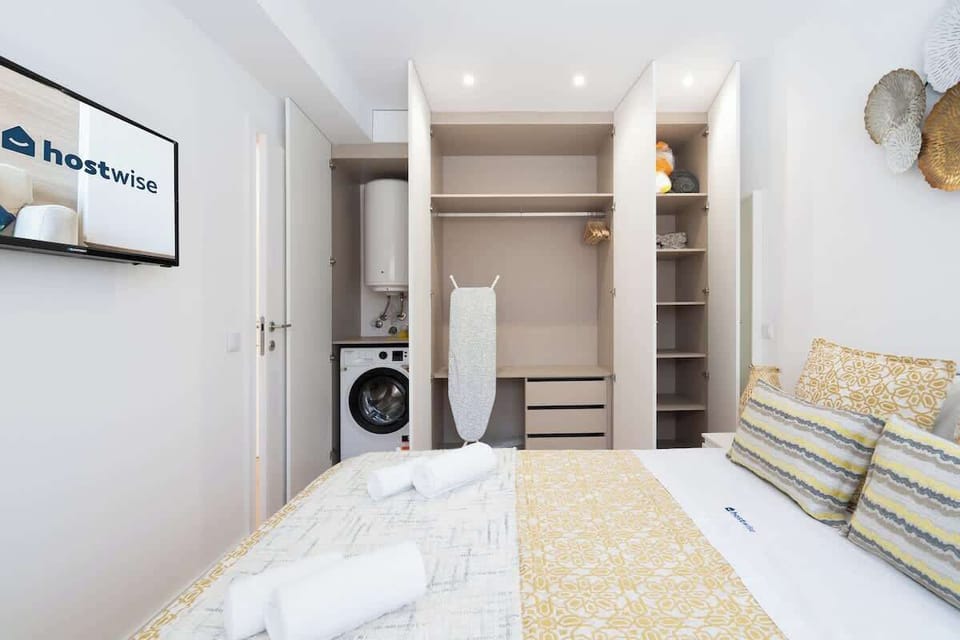 In the wardrobe you will find your washing machine and iron.