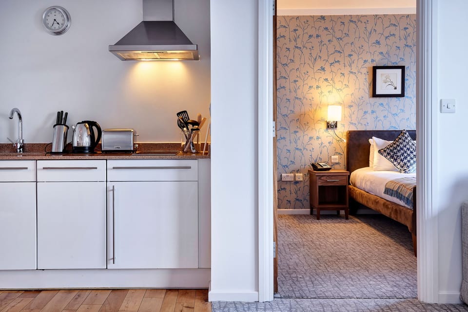 Fully equipped kitchen with modern appliances and elegant decor.