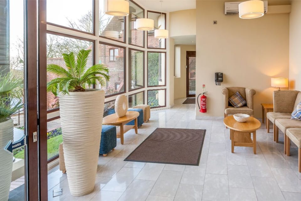 Spacious and contemporary living room with a cozy lounge area.