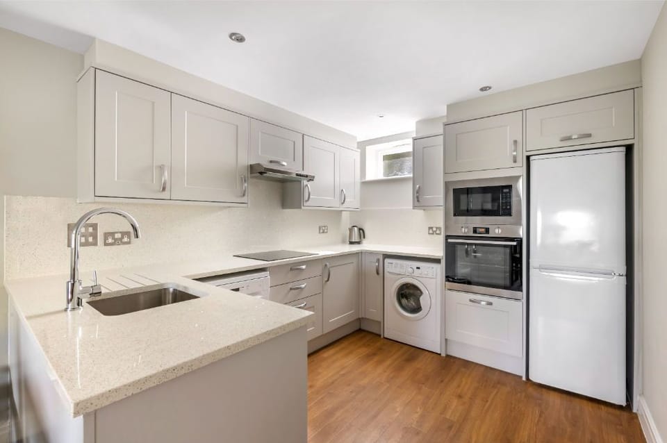 Functional kitchen with all the essentials for a home-cooked meal.