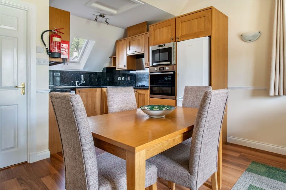 Dining area set for comfort and conversation, nestled within a warm ambiance.