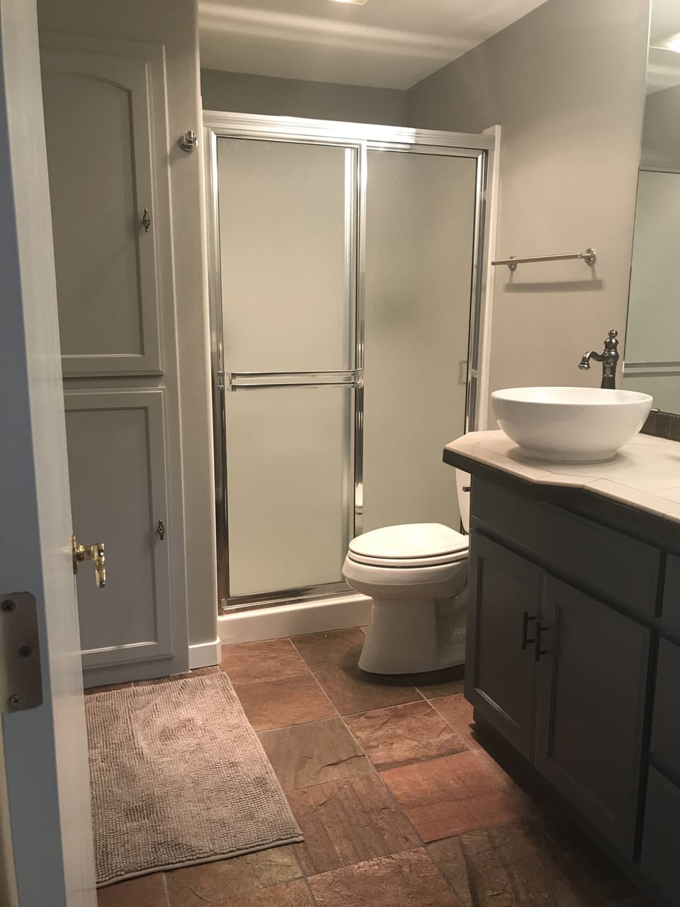Bathroom with shower and storage